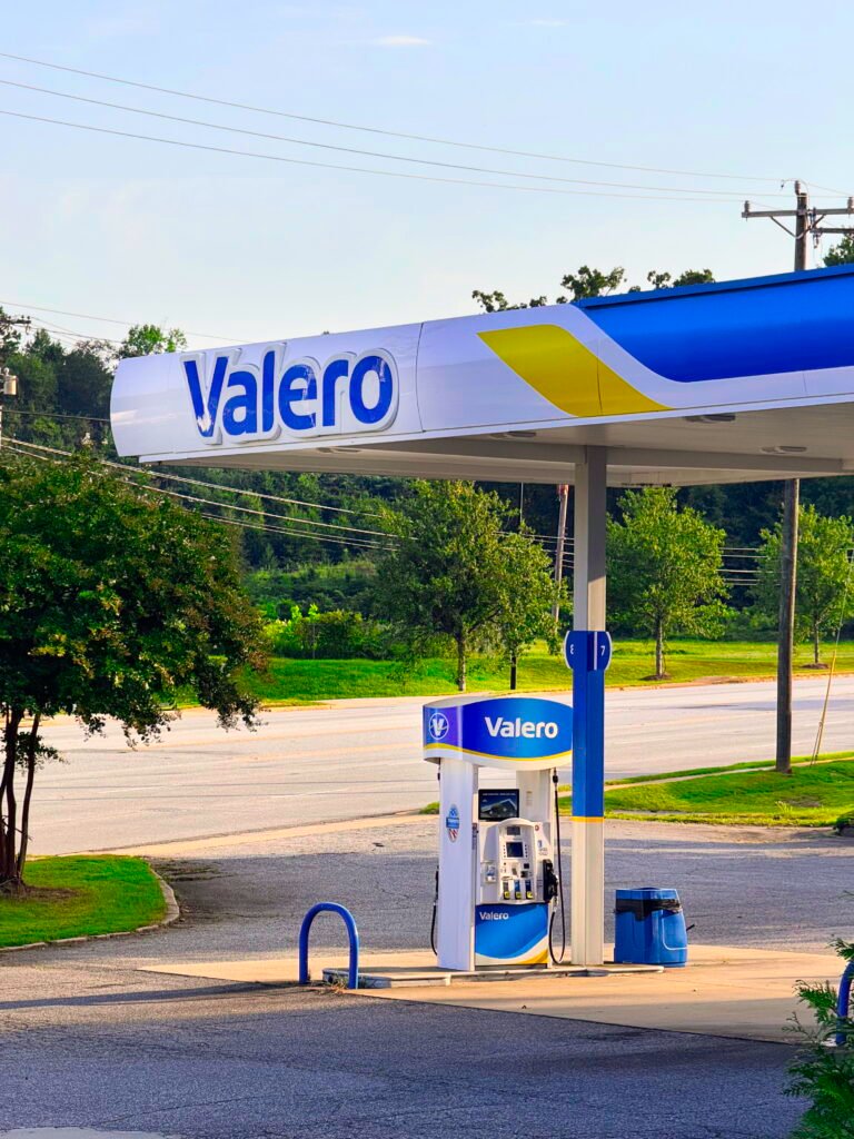 A Valero fuel pump under a gas station canopy in Greenville, South Carolina, in an article about US consumers paying $471 extra for fuel