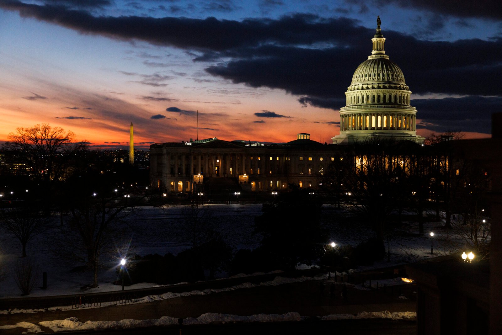 The United States Capitol building in the Washington, DC skyline at sunset