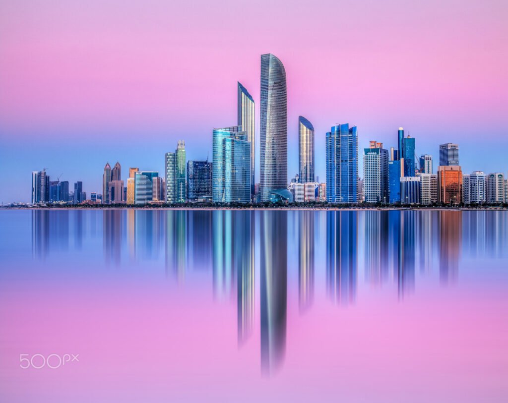 The Abu Dhabi skyline at blue hour, viewed from the Corniche