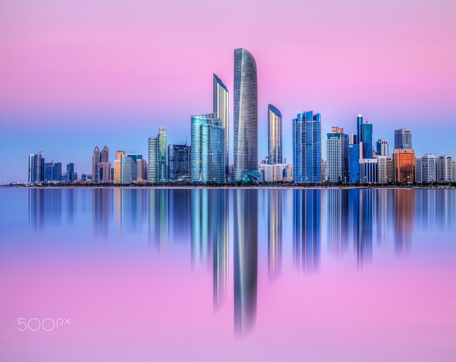 The Abu Dhabi skyline at blue hour, viewed from the Corniche